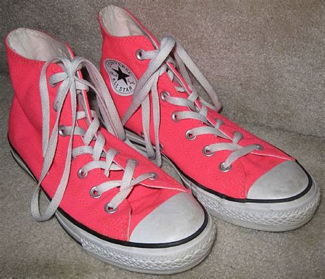 neon pink converse high tops.